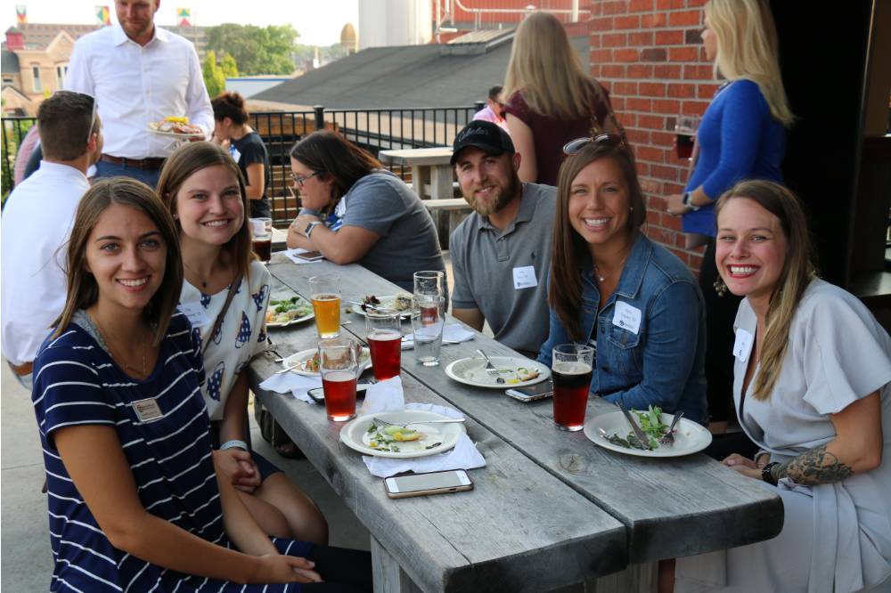 Members of the Young Alumni Council pose at Founders Brewing Co.